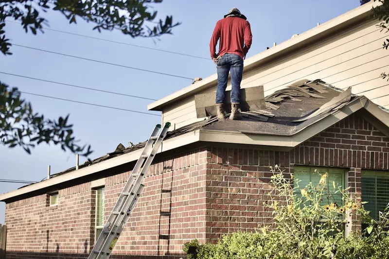 Professional roofer working on a residential roof in North Ranch